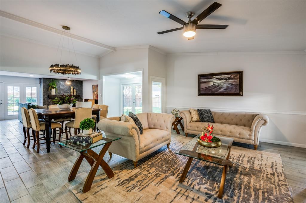 6000 Blue Ridge Trail Plano, TX 75023 - Photo 5 of 25 Living room with wood finished floors, crown molding, vaulted ceiling, and ceiling fan
