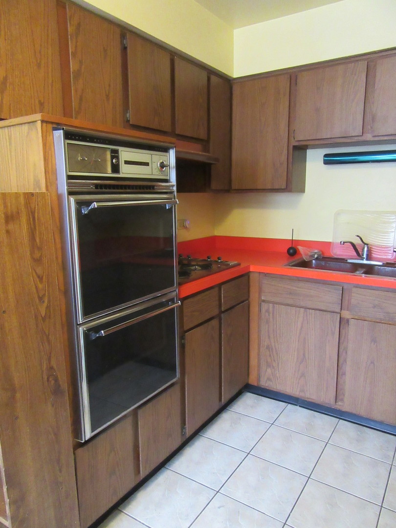 740 Jr Terrace Elmhurst, IL 60126 - Photo 7 of 22 a storage room with cabinets
