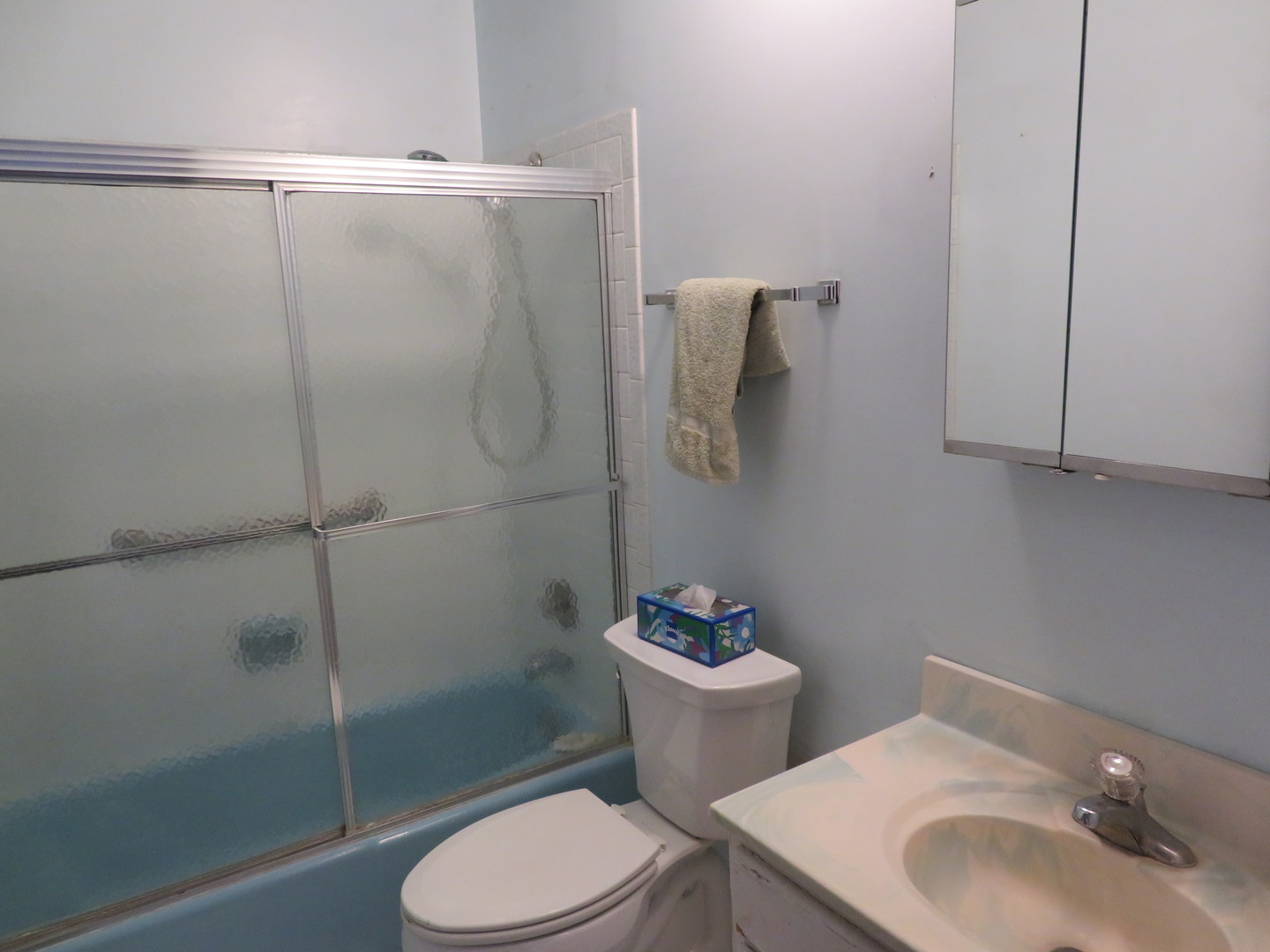 740 Jr Terrace Elmhurst, IL 60126 - Photo 10 of 22 a white toilet sitting next to a bathroom sink