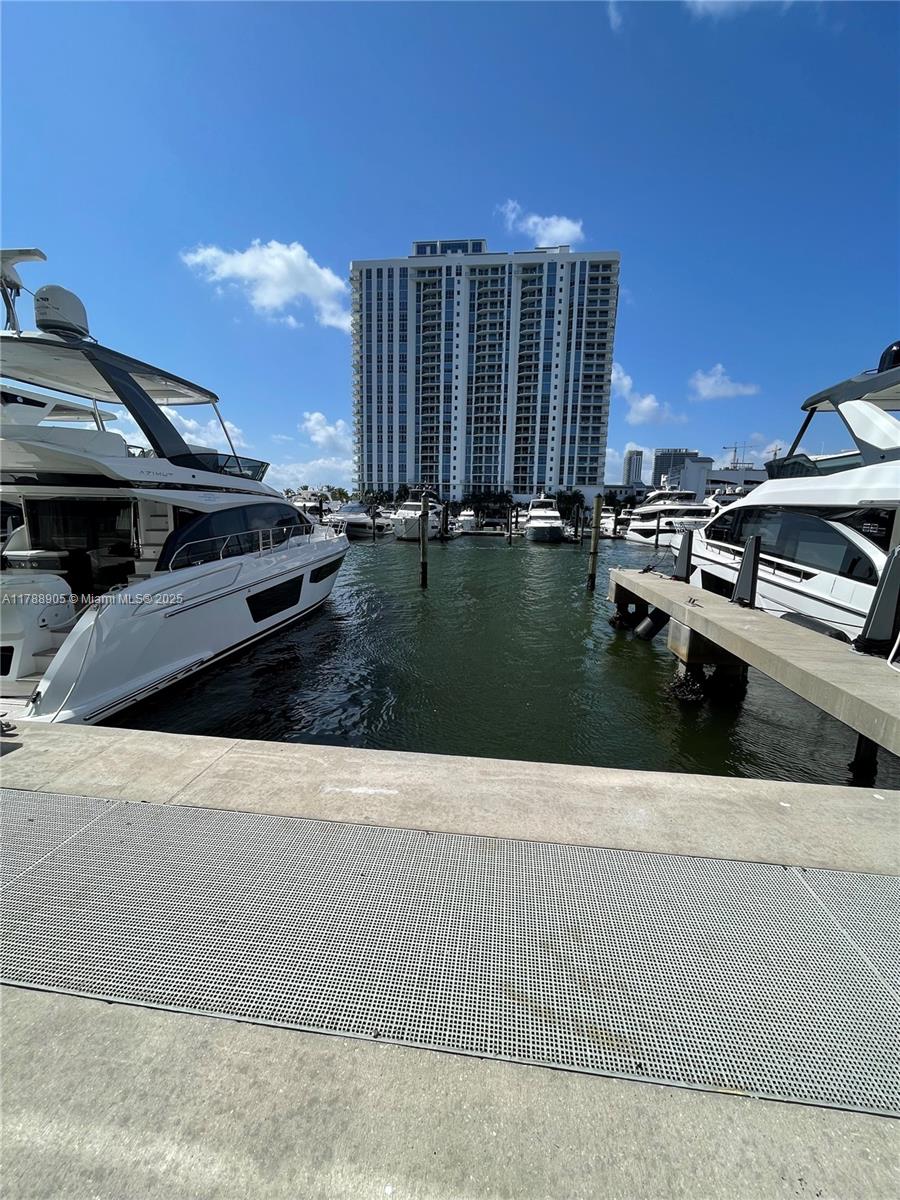 17211 Biscayne Boulevard, Unit 100 North Miami Beach, FL 33160 - Photo 2 of 7 a view of a back yard of the house