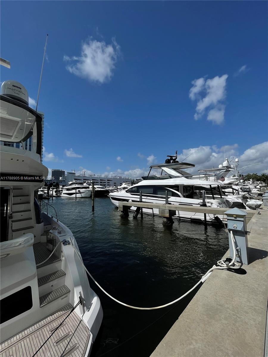 17211 Biscayne Boulevard, Unit 100 North Miami Beach, FL 33160 - Photo 3 of 7 a view of a swimming pool with outdoor seating