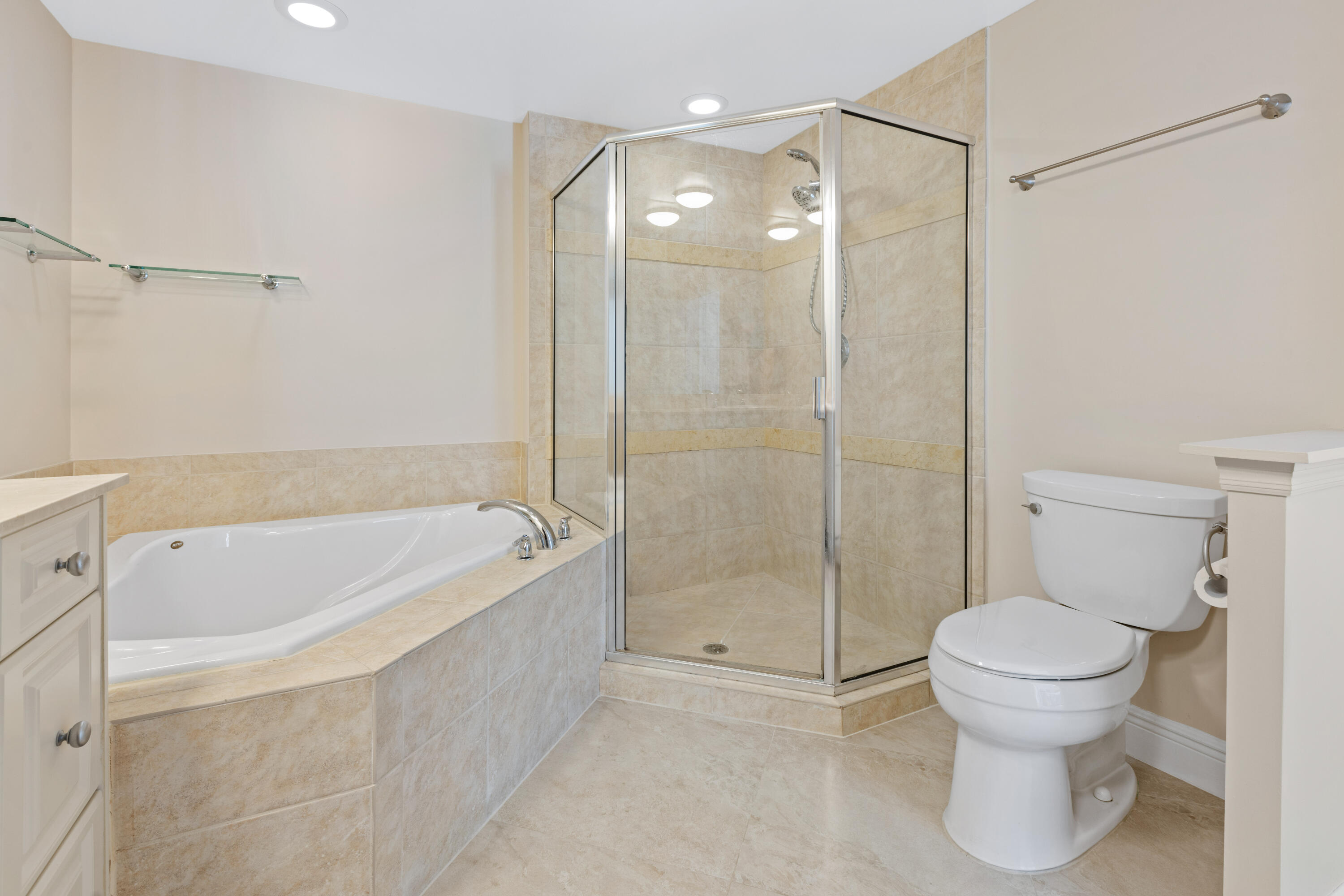 275 Northwest Flagler Avenue, Unit 205 Stuart, FL 34994 - Photo 14 of 43 a bathroom with a bathtub and a toilet