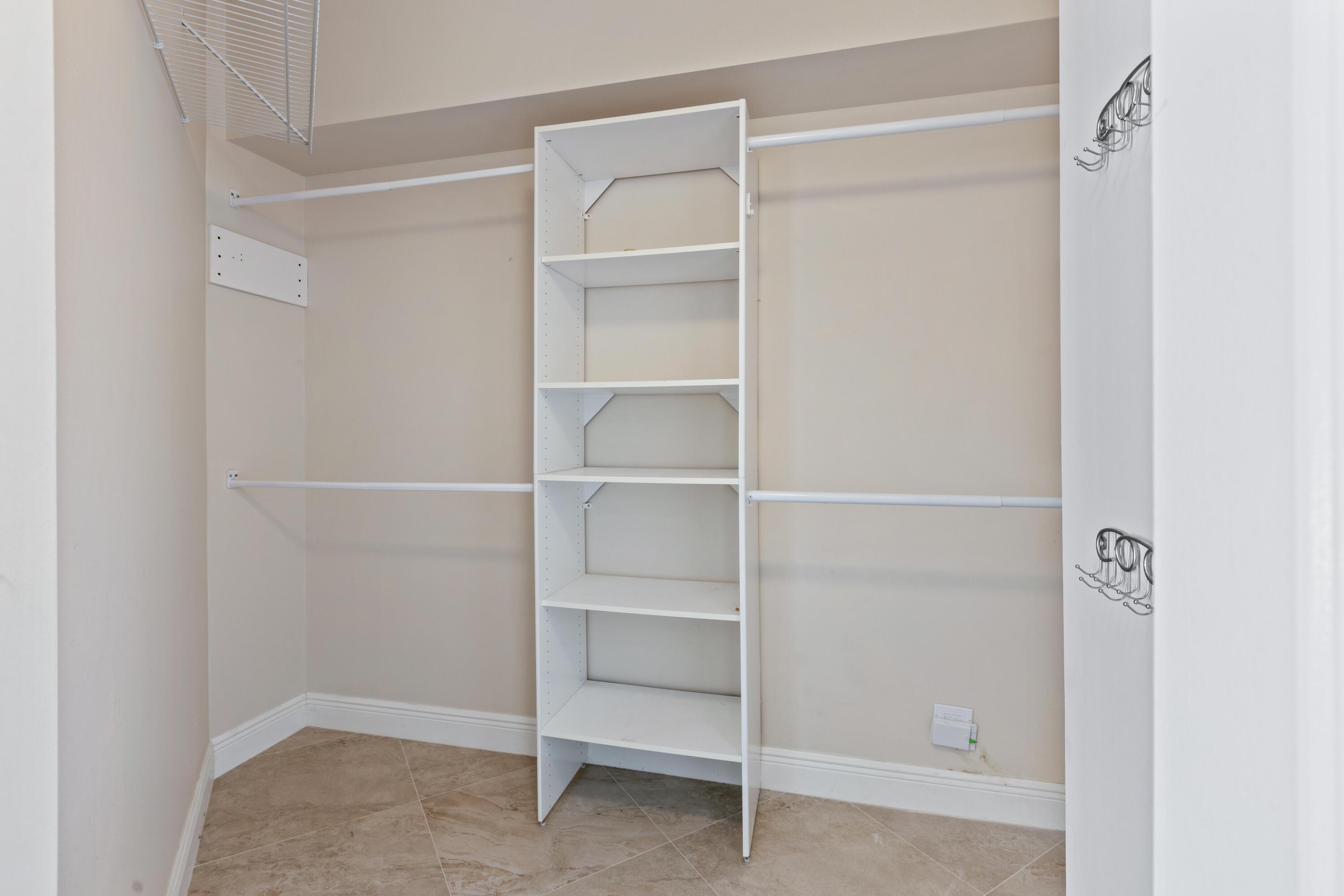 275 Northwest Flagler Avenue, Unit 205 Stuart, FL 34994 - Photo 16 of 43 a view of an empty walk in closet