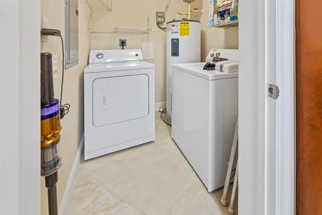 a view of a balcony with furniture and front door