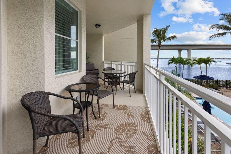 275 Northwest Flagler Avenue, Unit 205 Stuart, FL 34994 - Photo 23 of 43 a view of a chairs and table in the balcony
