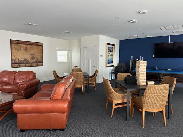 275 Northwest Flagler Avenue, Unit 205 Stuart, FL 34994 - Photo 33 of 43 a view of a livingroom with furniture and a window
