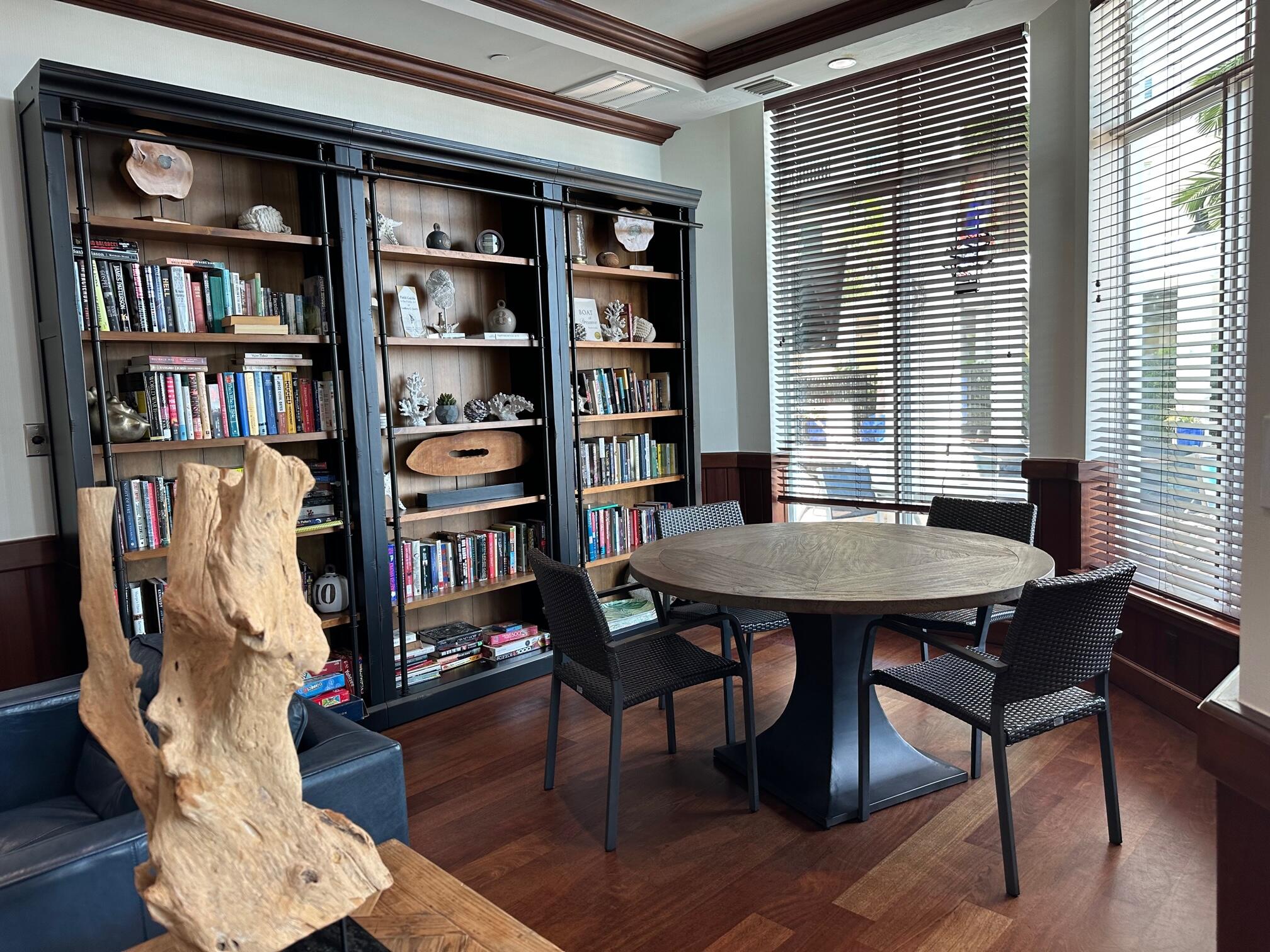 275 Northwest Flagler Avenue, Unit 205 Stuart, FL 34994 - Photo 35 of 43 a view of a workspace with furniture and a bookshelf