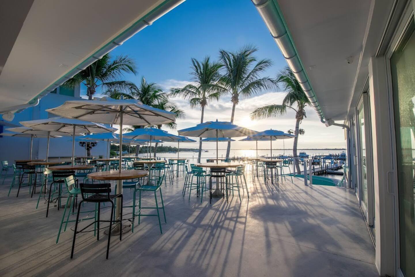 275 Northwest Flagler Avenue, Unit 205 Stuart, FL 34994 - Photo 40 of 43 an outdoor space with patio furniture with wooden floor