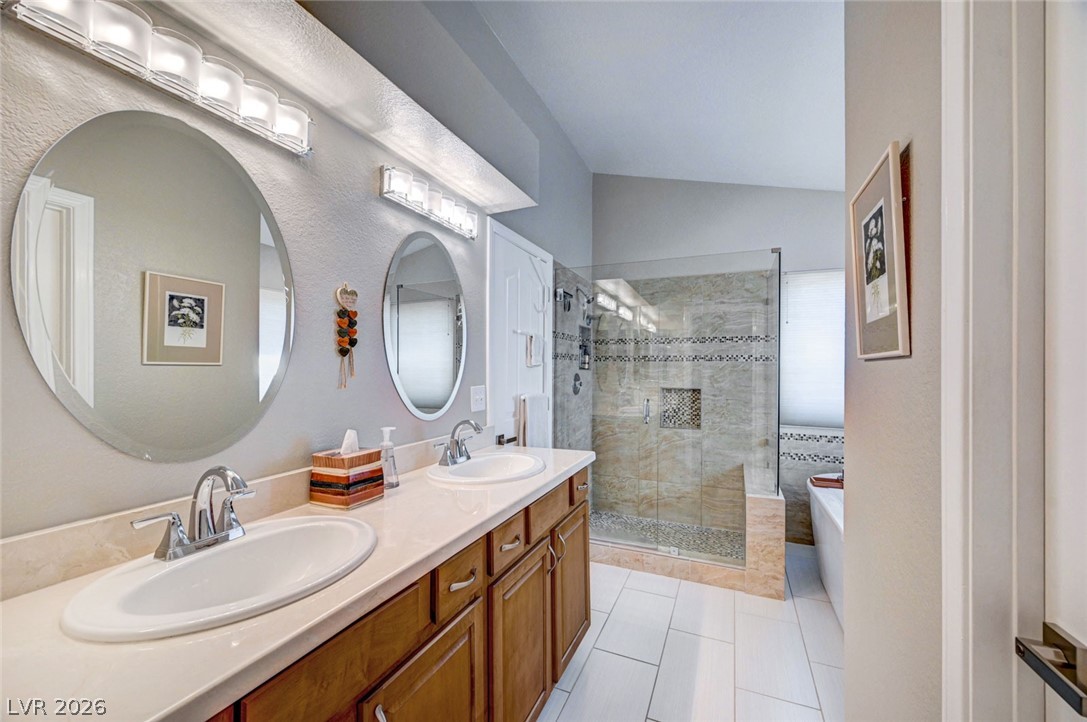 2600 Frontera Road Henderson, NV 89074 - Photo 33 of 47 View of primary bath vanity and door leading to primary suite