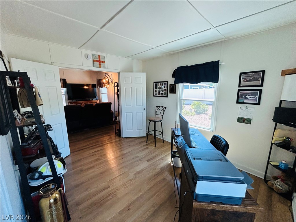 116 West Basic Road Henderson, NV 89015 - Photo 13 of 39 Hardwood floors flow through this bright, adaptable space, perfect for work or leisure.