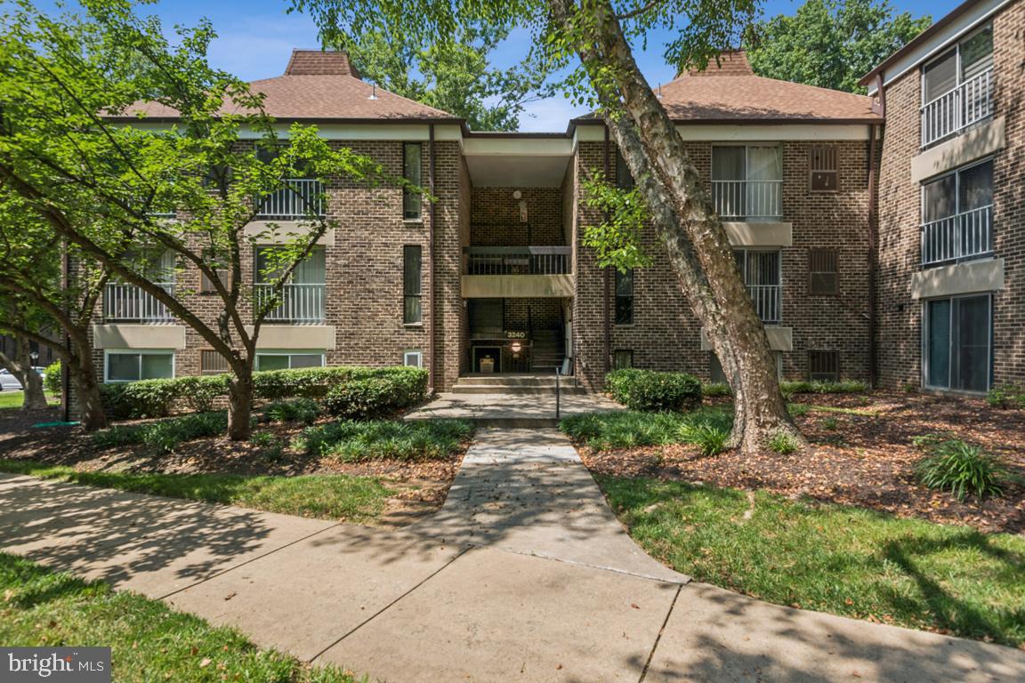 3240 Hewitt Avenue, Unit 63A Silver Spring, MD 20906 - Photo 1 of 22 a front view of a house with garden