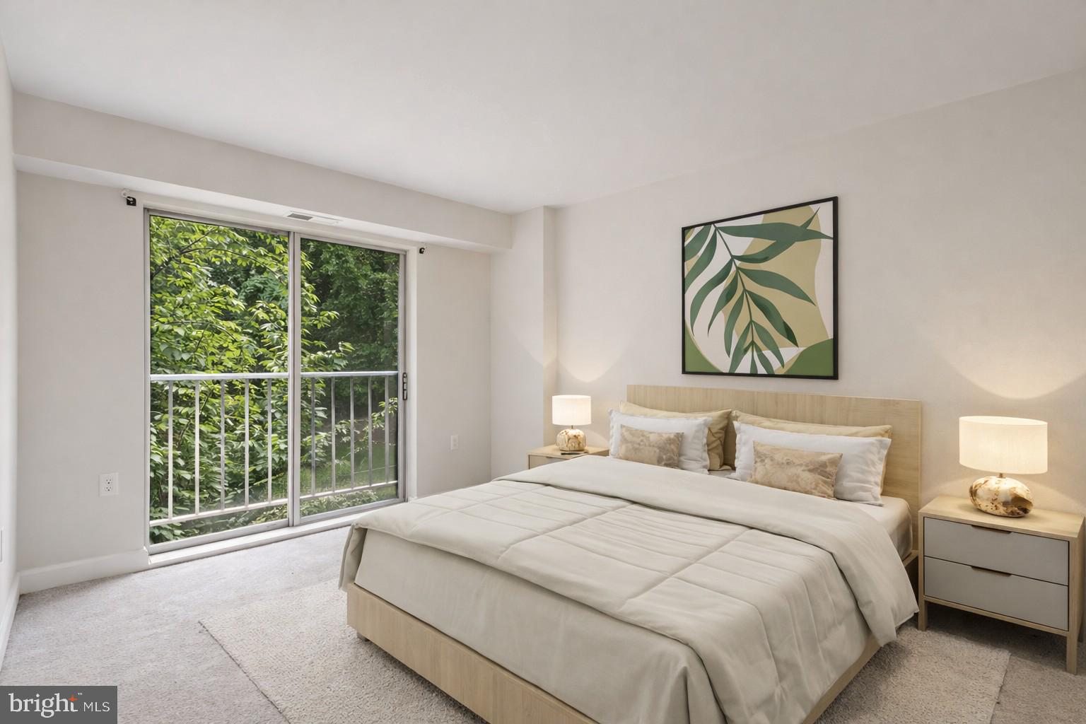 3240 Hewitt Avenue, Unit 63A Silver Spring, MD 20906 - Photo 13 of 22 a bedroom with a bed and a painting on the wall