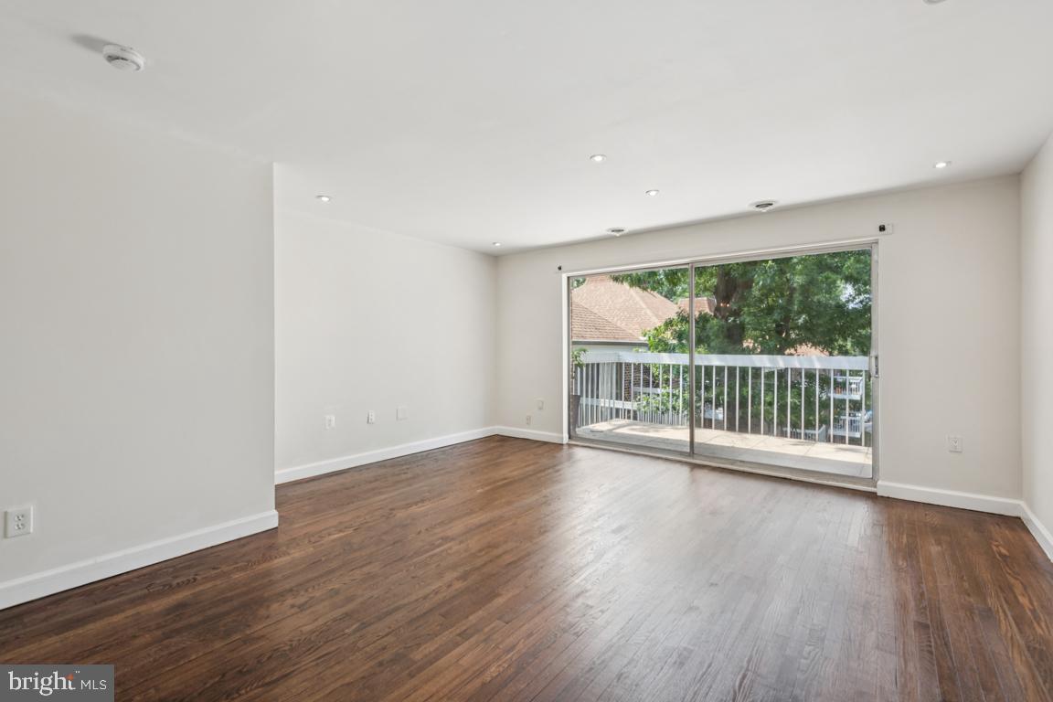 3240 Hewitt Avenue, Unit 63A Silver Spring, MD 20906 - Photo 3 of 22 a view of a room with wooden floor and window