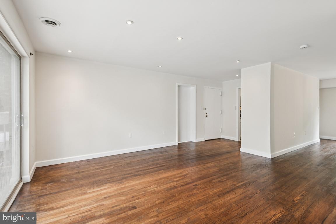 3240 Hewitt Avenue, Unit 63A Silver Spring, MD 20906 - Photo 4 of 22 a view of an empty room with wooden floor