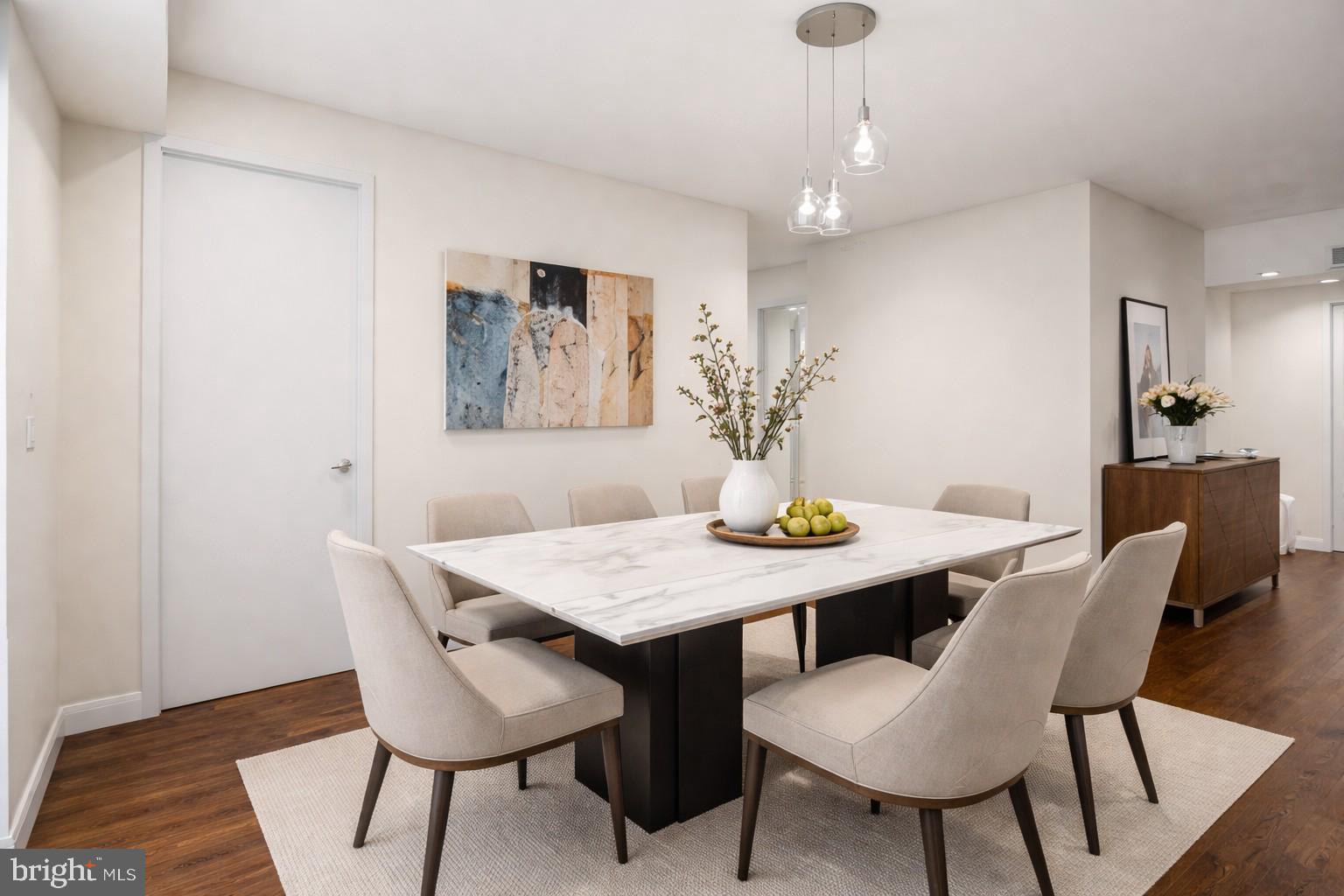 3240 Hewitt Avenue, Unit 63A Silver Spring, MD 20906 - Photo 5 of 22 a view of a dining room with furniture and wooden floor