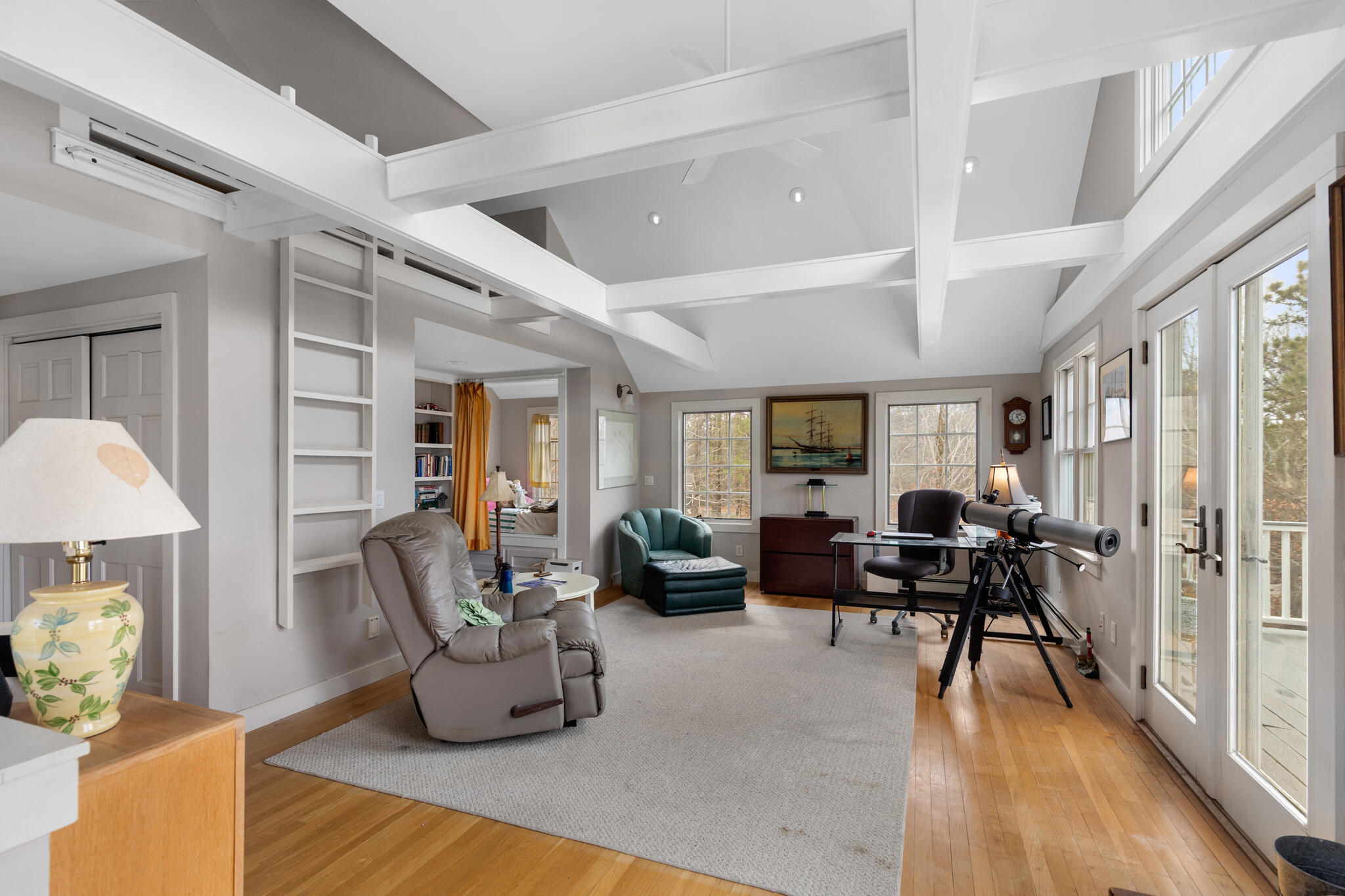 311 South Sunken Meadow Road Eastham, MA 02642 - Photo 30 of 57 a living room with furniture and a table