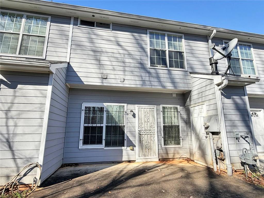2568 Walden Lake Drive Decatur, GA 30035 - Photo 12 of 16 a view of a brick house with large windows