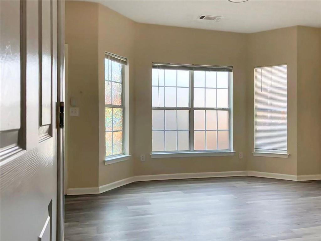 2568 Walden Lake Drive Decatur, GA 30035 - Photo 2 of 16 a view of an empty room with wooden floor and a window