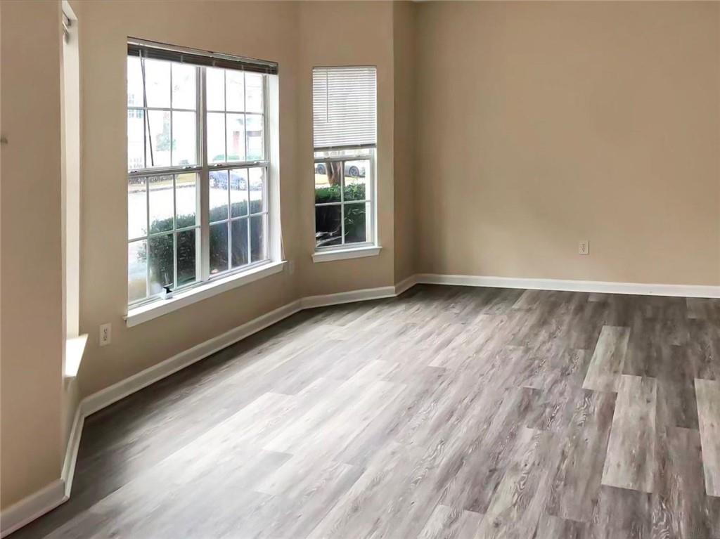 2568 Walden Lake Drive Decatur, GA 30035 - Photo 4 of 16 a view of an empty room with wooden floor and a window