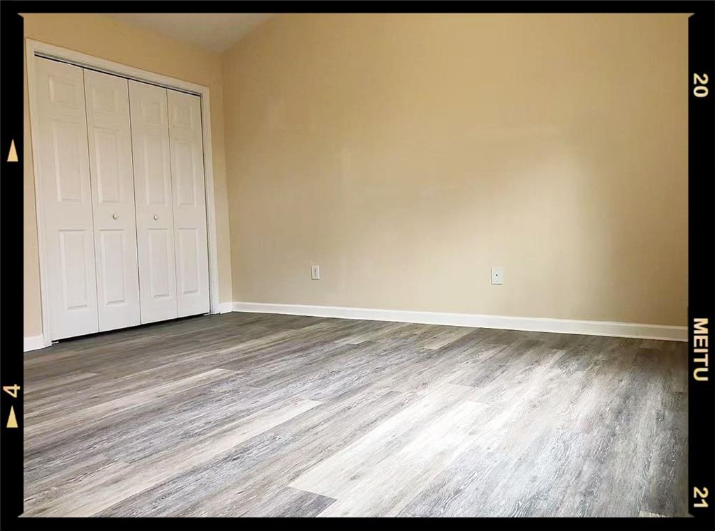 2568 Walden Lake Drive Decatur, GA 30035 - Photo 7 of 16 a view of empty room with wooden floor