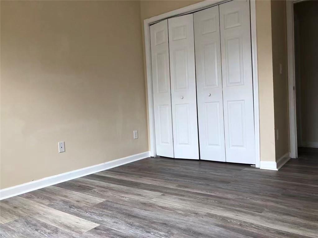2568 Walden Lake Drive Decatur, GA 30035 - Photo 8 of 16 a view of an empty room with wooden floor