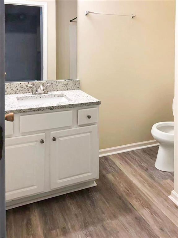 2568 Walden Lake Drive Decatur, GA 30035 - Photo 9 of 16 a bathroom with a sink a toilet and vanity