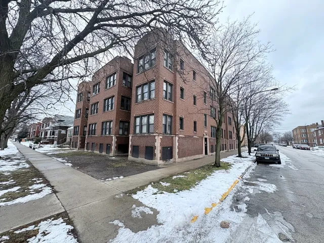 a view of a street with a building in the background