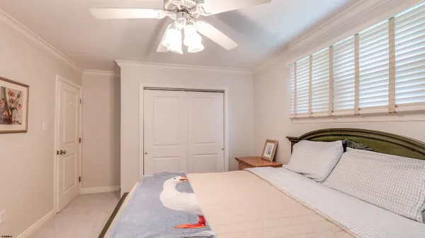 a view of a patio with table and chairs and potted plants