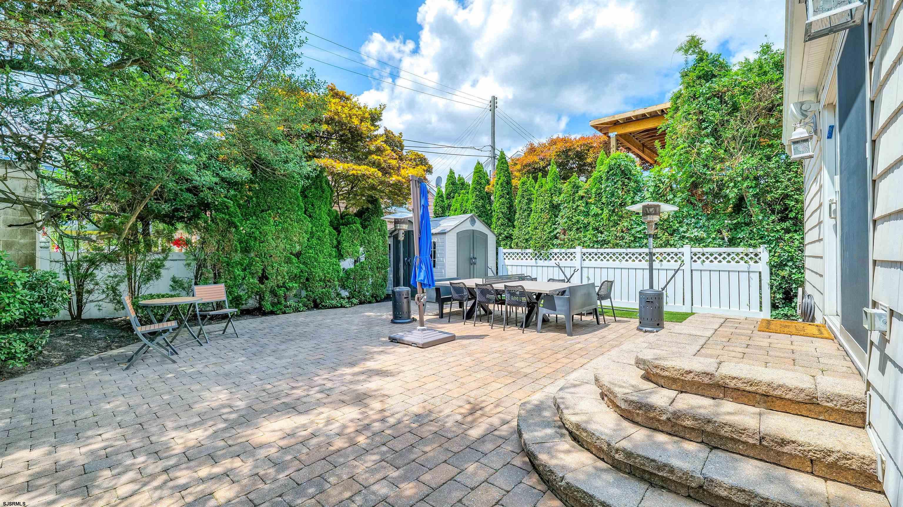 6 North Lancaster Avenue Margate City, NJ 08402 - Photo 28 of 32 a view of backyard with a patio and outdoor seating