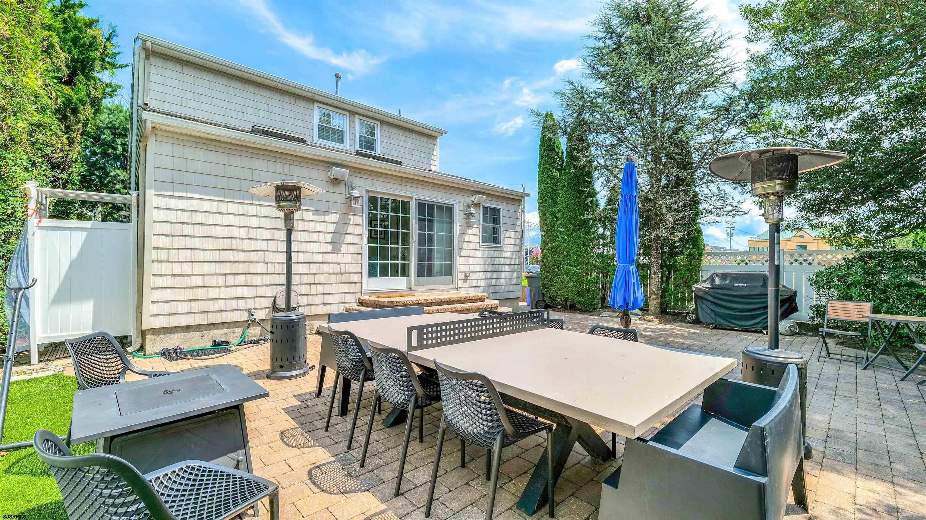 6 North Lancaster Avenue Margate City, NJ 08402 - Photo 30 of 32 a view of a patio with table and chairs and potted plants