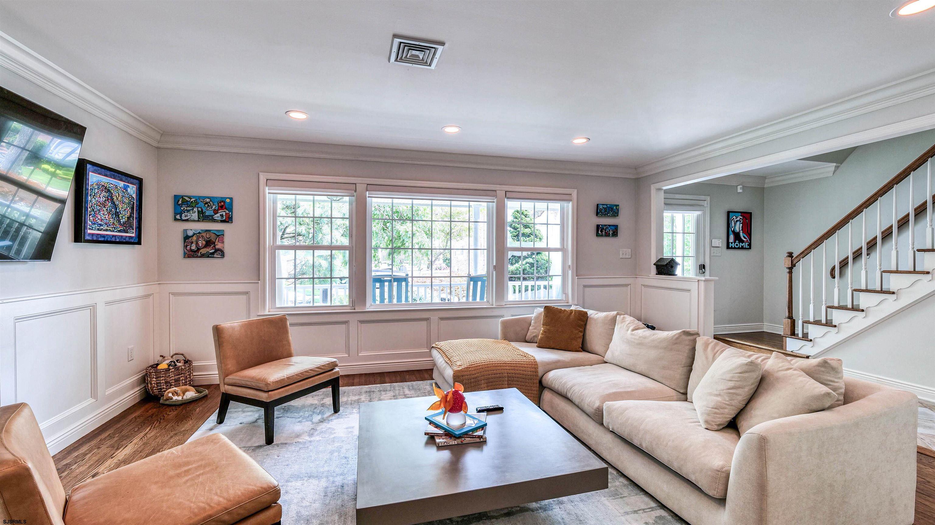 6 North Lancaster Avenue Margate City, NJ 08402 - Photo 8 of 32 a living room with furniture and a large window