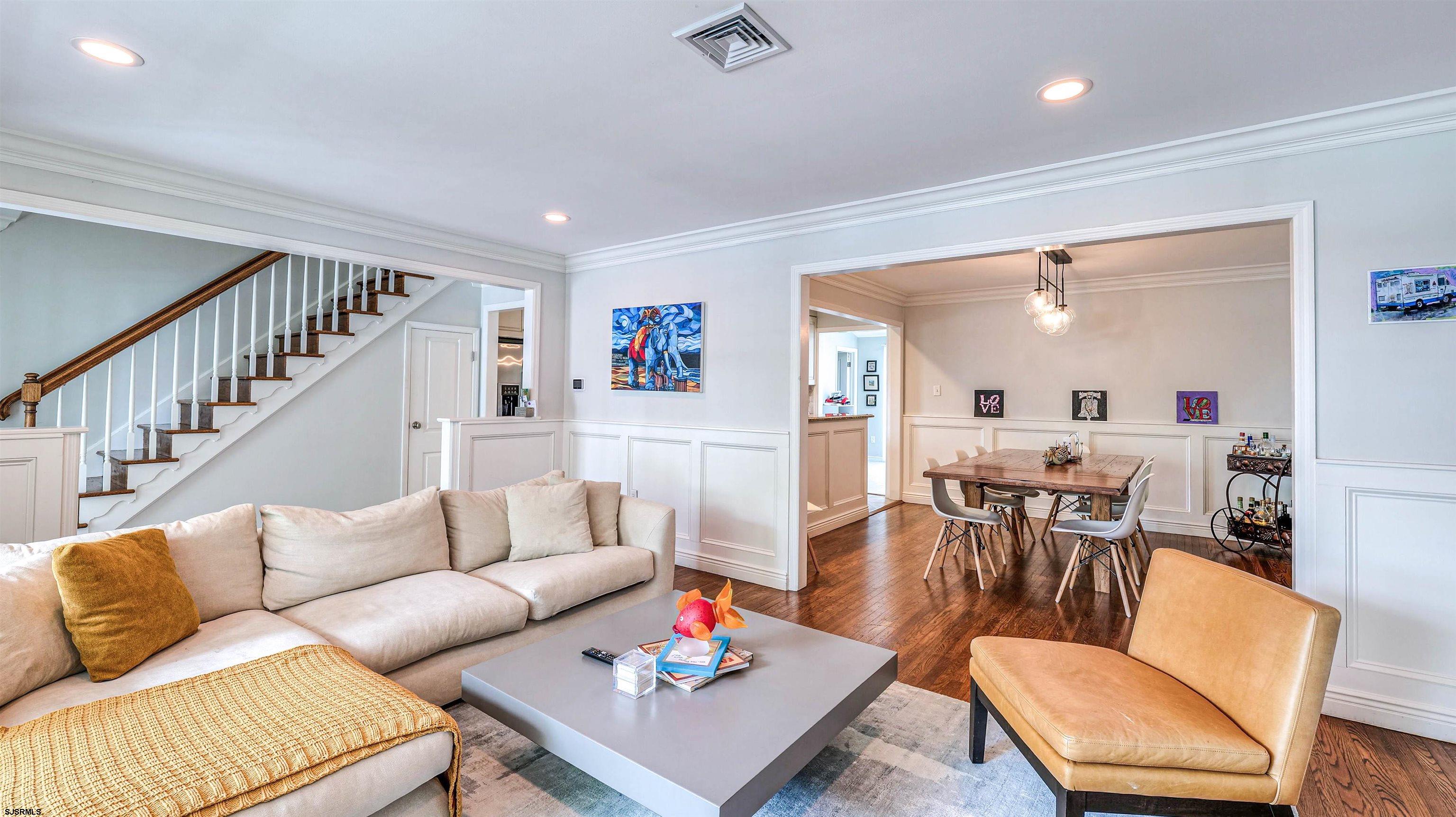 6 North Lancaster Avenue Margate City, NJ 08402 - Photo 9 of 32 a living room with furniture fireplace and a table
