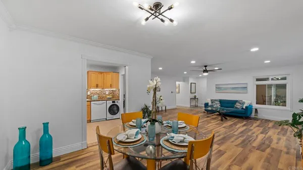 a view of a dining room with furniture window and wooden floor