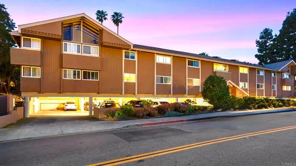 a front view of a house with a garage
