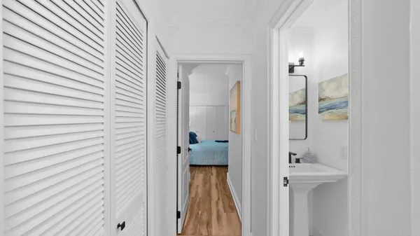 a bathroom with a sink mirror and toilet