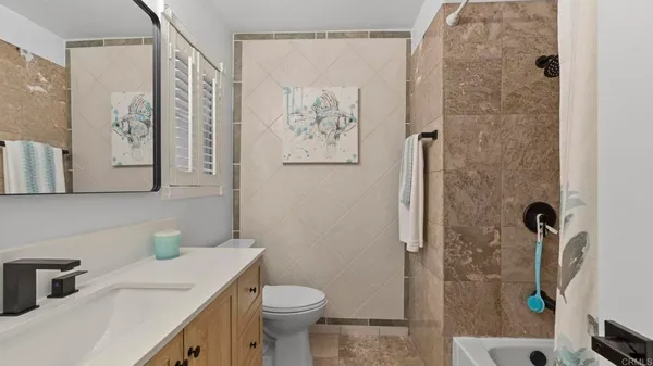 a bathroom with a sink a vanity and a mirror