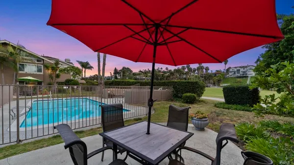 a view of a balcony with chair and table