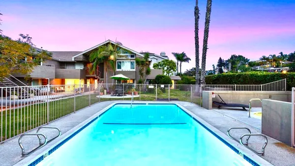 a swimming pool is in the middle of a field