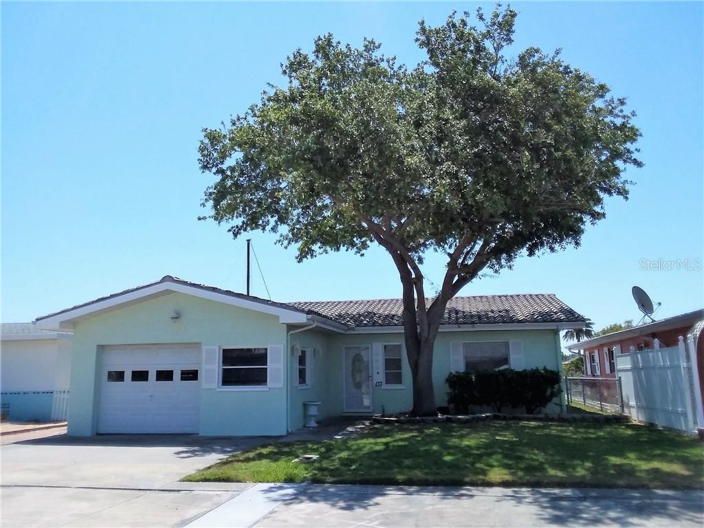 133 Wall Street Redington Shores, FL 33708 - Photo 1 of 1 a front view of a house with a garden