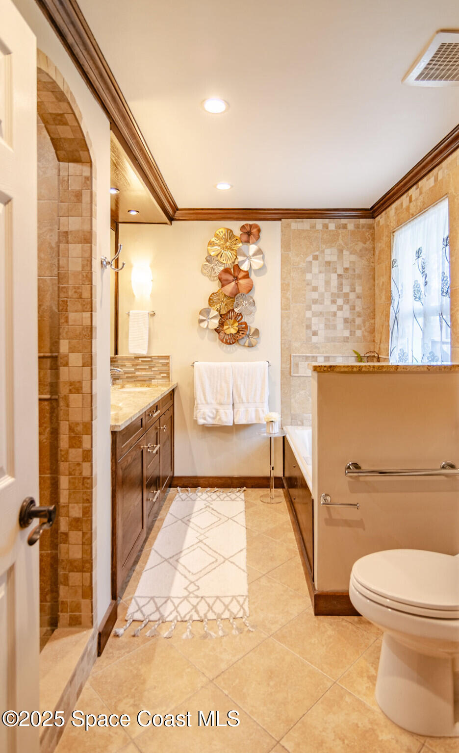315 Richards Road Melbourne Beach, FL 32951 - Photo 18 of 38 a bathroom with a sink a toilet and shower