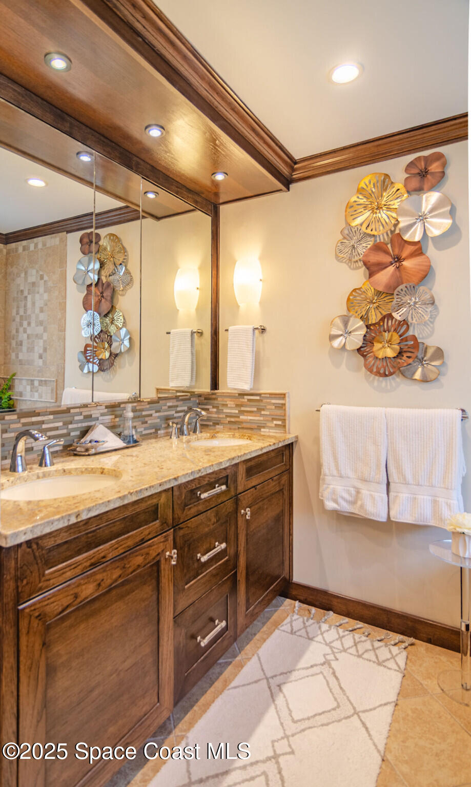 315 Richards Road Melbourne Beach, FL 32951 - Photo 20 of 38 a bathroom with a sink mirror and a shower
