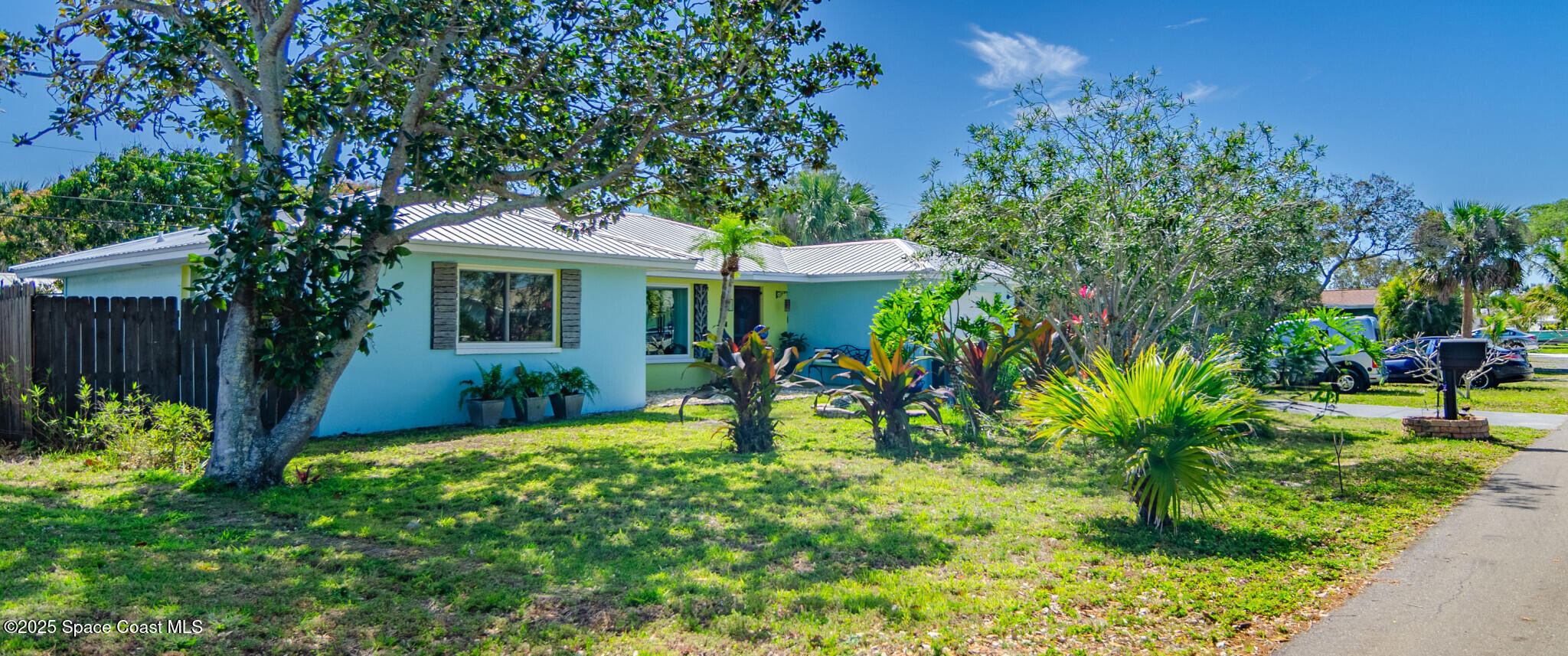 315 Richards Road Melbourne Beach, FL 32951 - Photo 3 of 38 front view of a house with a yard
