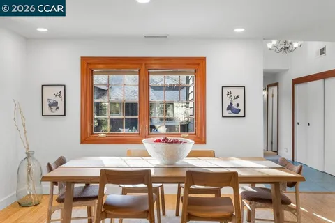 a dining room with furniture and window