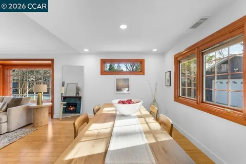 a bedroom with furniture and a large window