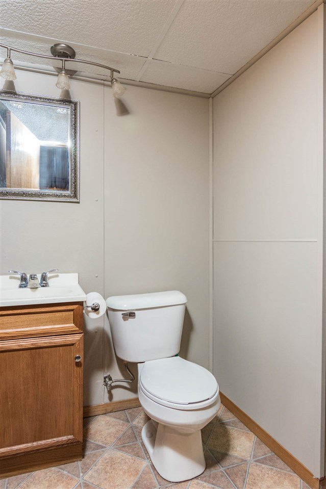 983 Winborne Road Lake Summerset, IL 61019 - Photo 14 of 22 a white toilet sitting next to a bathroom sink