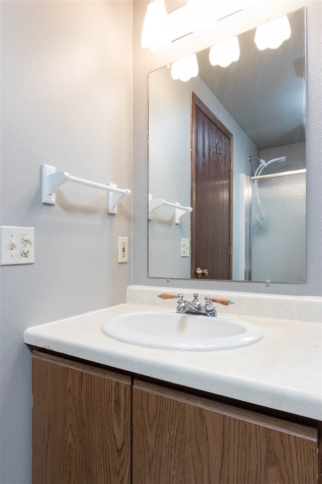 983 Winborne Road Lake Summerset, IL 61019 - Photo 16 of 22 a bathroom with a sink and a mirror