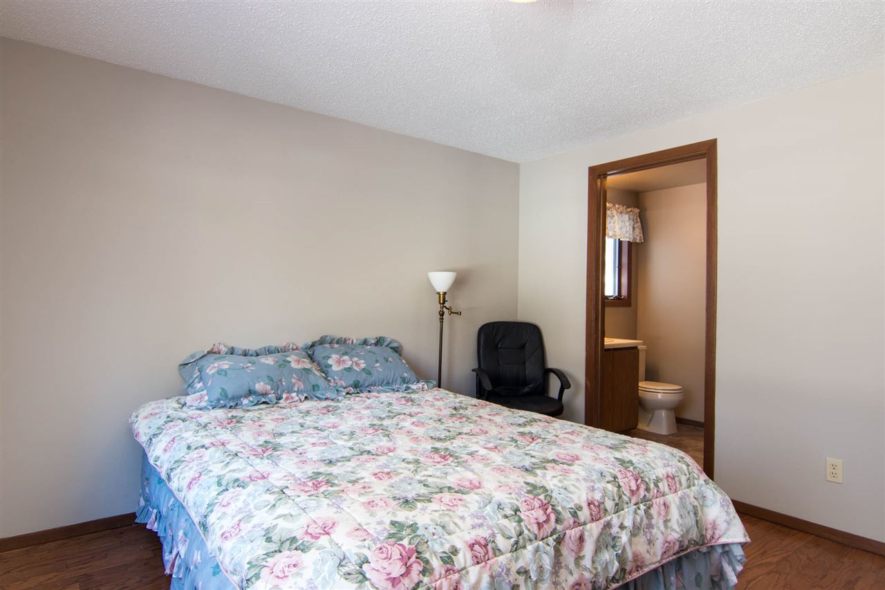 983 Winborne Road Lake Summerset, IL 61019 - Photo 17 of 22 a bedroom with a bed and wooden floor