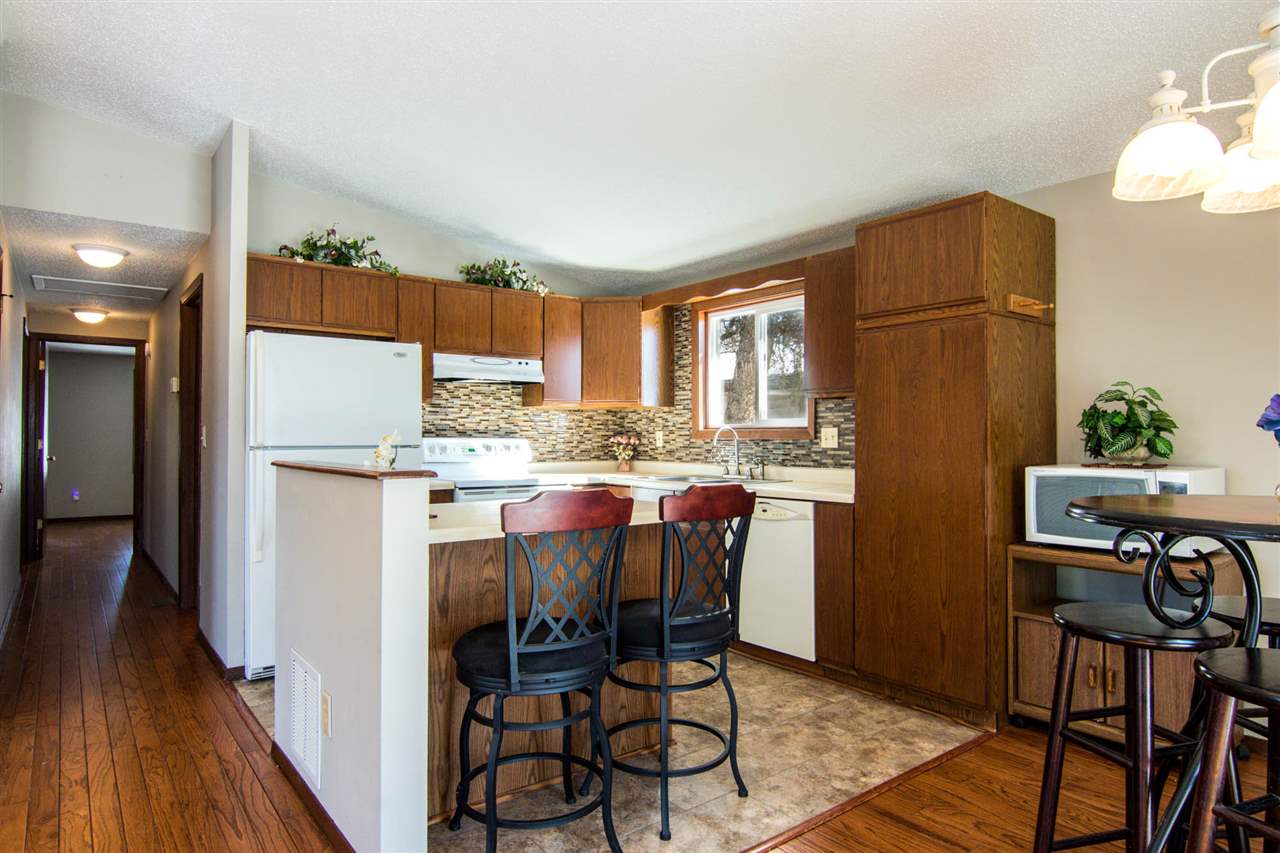 983 Winborne Road Lake Summerset, IL 61019 - Photo 6 of 22 a kitchen with stainless steel appliances granite countertop a refrigerator and a stove top oven