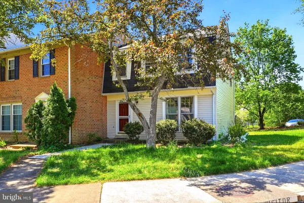 front view of a house with a garden