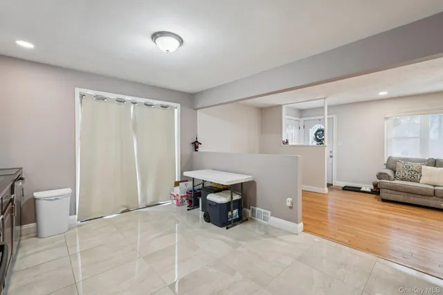 a bedroom with furniture and a wooden floor